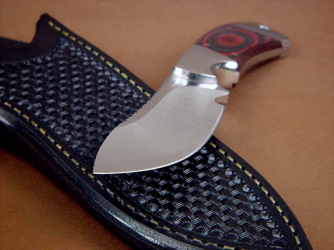 "Acamar" obverse side view in CPMS30V high vanadium stainless tool steel blade, 304 stainless steel bolsters, red-black canvas micarta phenolic handle, black basketweave leather sheath