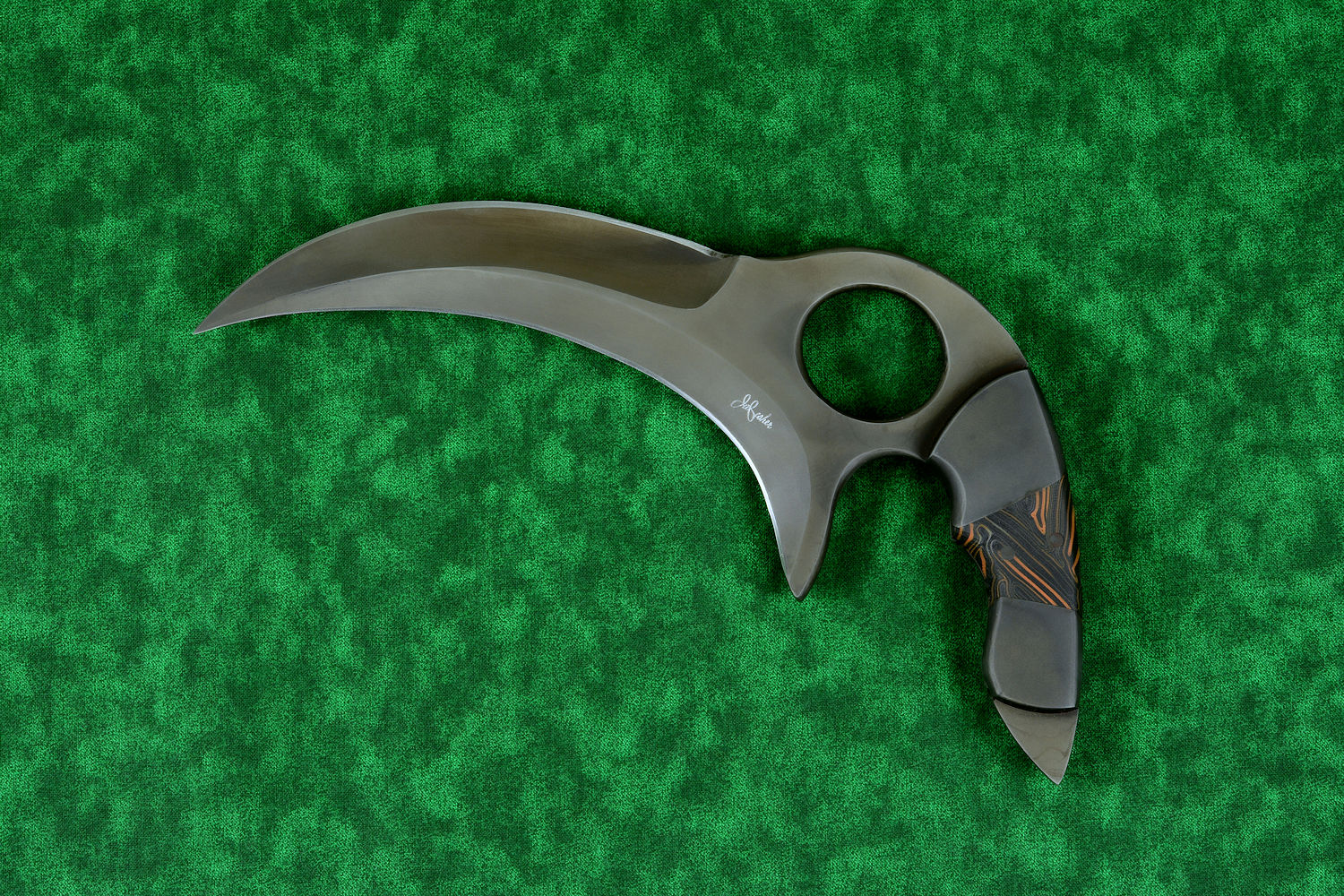 "Drepan" tactical karambit knife, obverse side view in T4 cryogenically treated 440C high chromium martensitic stainless steel blade, 304 stainles steel bolsters, orange/black G10 fiberglass epoxy composite laminate