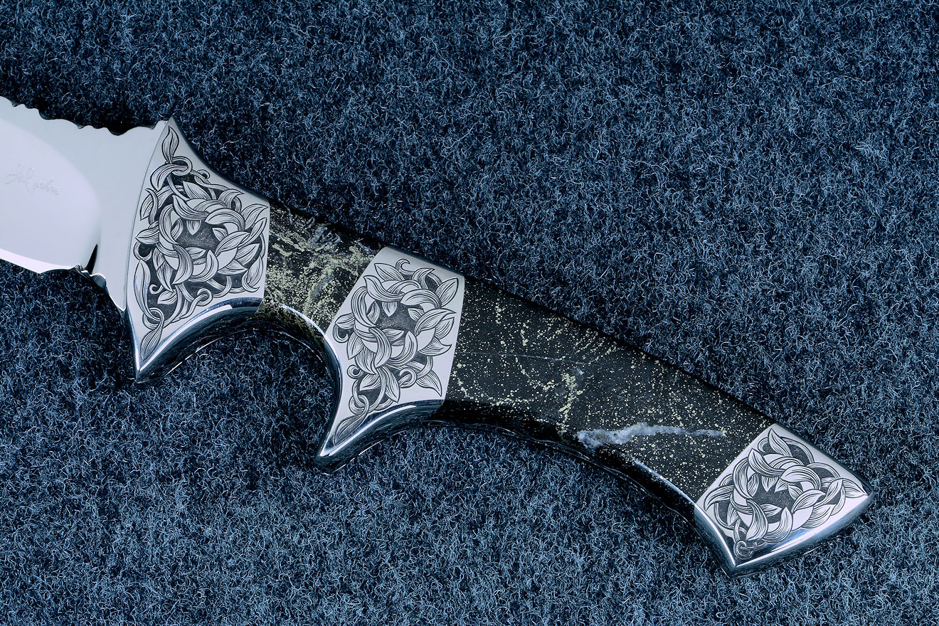 "Patriot" handle detail in hand-engraved 304 austenitic stainless steel bolsters and Golden Midnight Agate gemstone handle "Patriot" handle detail in hand-engraved 304 austenitic stainless steel bolsters and Golden Midnight Agate gemstone handle