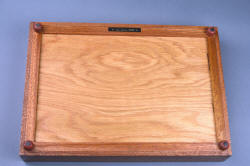 "Kadi" case bottom view. Feet are turned redheart hardwood, inlaid with foam neoprene. Maker's name and date plaque attached. "Kadi" case bottom view. Feet are turned redheart hardwood, inlaid with foam neoprene. Maker's name and date plaque attached.