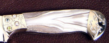 White geodic agate gemstone knife handle, faceted gemstones set in stainless steel bolster White geodic agate gemstone knife handle, faceted gemstones set in stainless steel bolster