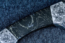 Swirling bands of pyrite and white agate in black hornfels Swirling bands of pyrite and white agate in black hornfels