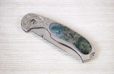 Indian Green Moss Agate is transparent in thin sections, shown on this linerlock folding knife handle inlay Indian Green Moss Agate is transparent in thin sections, shown on this linerlock folding knife handle inlay