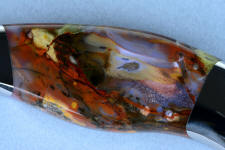 Green, red, orange, pink, tan, and black dendritic forms in hard Majestic Agate gemstone knife handle Green, red, orange, pink, tan, and black dendritic forms in hard Majestic Agate gemstone knife handle