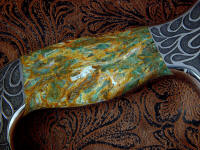 Plasma agate has green agate with bits of red and gold veining, a striking and complex gemstone Plasma agate has green agate with bits of red and gold veining, a striking and complex gemstone