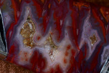 Sonoran Flame agate in a 6 power magnification is stunning, hard and takes a bright, glassy polish Sonoran Flame agate in a 6 power magnification is stunning, hard and takes a bright, glassy polish