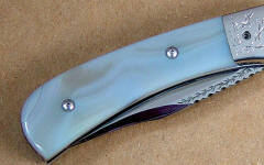 White Geodic Agate mounted on linerlock folding knife White Geodic Agate mounted on linerlock folding knife