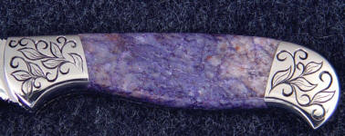 Dumortierite is an unusual purple gemstone with small orange-brown flakes Dumortierite is an unusual purple gemstone with small orange-brown flakes