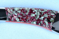 Eudialite has violet-red crystals throughout Eudialite has violet-red crystals throughout