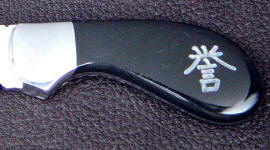 Black Jade gemstone, rotary diamond engraved, on custom handmade knife Black Jade gemstone, rotary diamond engraved, on custom handmade knife