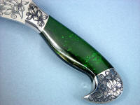 Nephrite Jade gemstone on custom hatchet handle is tough, hard, and durable Nephrite Jade gemstone on custom hatchet handle is tough, hard, and durable