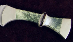 Nephrite Jade's toughness is due to interlocking microscopic fibrous crystals Nephrite Jade's toughness is due to interlocking microscopic fibrous crystals
